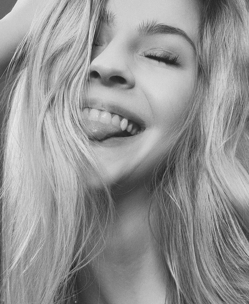 Woman with healthy smile after hygiene appointment